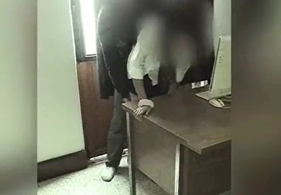 The camera writes off teachers and student in the school office